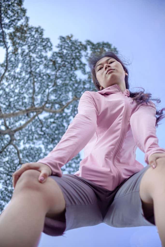 shallow focus photo of woman in pink full-zip jacket